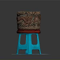 Carved Brown Container With Red Base On Blue Stool Shaped Stand