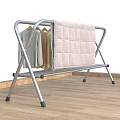 Metal Clothes Drying Rack With Hanging Bars Drying Clothes And Quilt On Balcony
