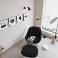 Stylish Black Chaise Lounge in Living Room with Framed Pictures Floor Lamp and Potted Plant