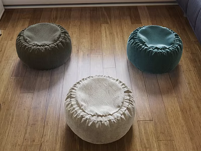 Round Fabric Footstools In Neutral Tones On Wooden Floor Home Decor 3d model