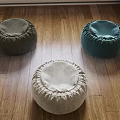 Round Fabric Footstools In Neutral Tones On Wooden Floor Home Decor