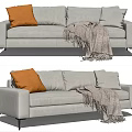 Light Gray Two Seater Sofa Featuring Orange Cushion Gray Fringe Blanket And Black Slim Legs