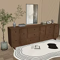 Light brown wooden entryway console cabinet with drawers wall art and plant decor