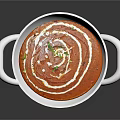 Creamy Red Soup With White Swirls And Green Garnish In White Bowl