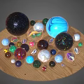 Assorted Colorful Glass Marbles With Diverse Patterns and Textures On Wooden Surface