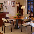Cozy Wooden Round Dining Table With Four Beige Chairs Green Flower Vase And Fruit Plate