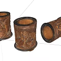 Three Carved Wooden Pen Holders With Intricate Patterns And Classic Design