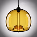 Contemporary Yellow Glass Spherical Pendant Light With Black Metal Accents For Home Interior