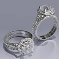 Elegant Diamond Rings With Round Center Stones And Intricate Metal Band Design