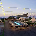 Rooftop Bar with String Lights Pool Tents Wooden Deck and Outdoor Seating