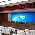 Spacious Conference Room With Large Screen Windows Logo And Rows Of Seats