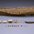 Vintage Industrial Equipment Collection Featuring Wooden Boat Crates Small Boat and Tools