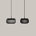 Two Modern Grid Design Pendant Lights Emitting Warm Light Against White Wall 3d model