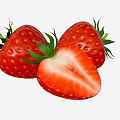 Three Fresh Ripe Strawberries With One Halved Showing Juicy Red Flesh And Green Leaves