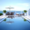 Scenic Oceanfront Terrace With Swimming Pool Umbrella Loungers Palm Trees And Distant Mountains