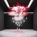 Hanging Cloud Shaped Art Installation With Pink Flowers White Ornaments And Scattered Petals