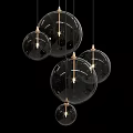 Modern Transparent Glass Sphere Chandeliers with Metal Frames Illuminated Hanging in Interior Design