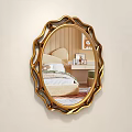 Oval Gold Framed Mirror Reflecting Bedroom Scene with Bed Nightstand Desk Chair and Striped Wall