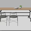 Industrial Table and Chair Set with Wooden Tabletop Black Metal Frame Gray Seats and Potted Plant