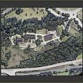 Architectural Building Model with Complex Structures Surrounded by Lush Trees and Greenery