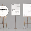 Various Modern Poster Designs On Gold Easels With Minimal Typography And Subtle Branding