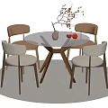 Modern Round Dining Table Set with Beige Chairs Vase Branches Red Decor on Neutral Rug