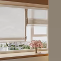 White Roller Blinds on Window with City View Green Plants and Pink Flowers