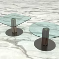Modern Coffee Tables With Glass Tops And Metal Bases On Marble Floor