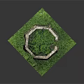 Circular Stone Wall Enclosure Surrounded by Lush Green Grass and Plants