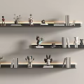 Three Black Wall Shelves With LED Lighting Decorative Items Books Plants Figurines On Light Wall