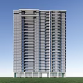 Modern High Rise Building With Glass Facade On Green Lawn And Blue Sky