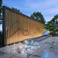 Wooden Feature Wall With Wavy Vertical Slats Warm Lighting Water Fountain and Pine Tree