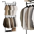 Clothing Hangers On Stand Display Various Neutral Toned Sweaters And Tops