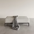 Light Gray Textured Bench With Dark Legs And Houndstooth Blanket In Modern Interior