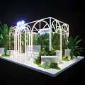 Floral Installation Featuring White Arched Frame Green Foliage Palm Leaves And Mossy Base