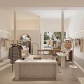 Minimalist Clothing Store Interior With Clothing Racks Display Tables And Natural Light