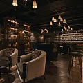 Stylish Bar Interior With Chandeliers Wine Racks Leather Armchairs And Wooden Flooring