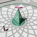 Green Cone Structure With Pink Top On Geometric Patterned Ground And Person 3d model