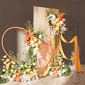 Floral Decoration With Orange Heart Shaped White Flowers Green Plants On Marble Surface