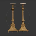 Elegant Pair Of Golden Candlesticks With Carved Base And Ornate Design