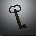 Antique Brass Key With Ornate Ring Handle And Carved Shaft On Dark Background
