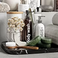 Essential Bathroom Accessories Including Rolled Towels Body Wash Bottles And Ceramic Containers