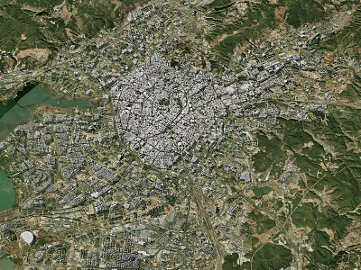 Satellite View Of Urban City Area Surrounded By Green Mountains And Natural Landscapes 3d model
