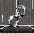 Stainless Steel Infinity Symbol Sculpture in Urban Square with Black Base