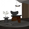 Black Leather Leisure Chair With Wooden Base And Small Table Under Pendant Light On Rug