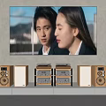 Modern Television Displaying Two People Scene With Speakers And Audio Equipment In Living Room