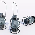 Three Vintage Kerosene Lanterns Two Standing One Lying With Metal Frames Glass Shades