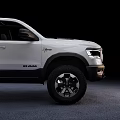 White Ram 1500 Crew Cab Pickup With Off Road Tires And Black Wheels