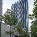 Modern High Rise Buildings With Glass Facades And Balcony Designs In Urban Skyline