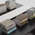 Stacked Books With Decorative Covers And Various Colors On Black Table